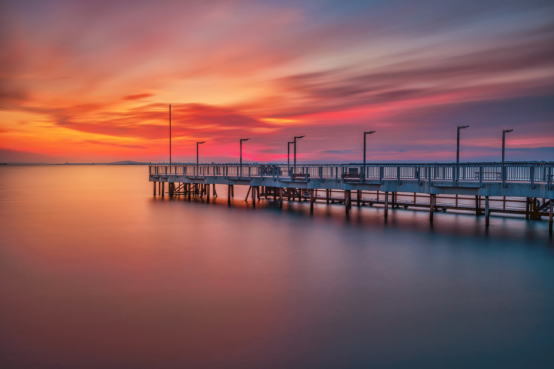 Sunset over the pier от Vasil Nanev - vnanev